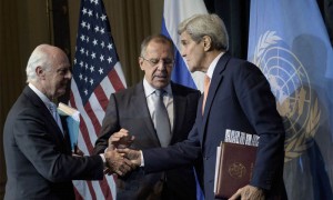 Russian Foreign Minister Sergei Lavrov (C) reaches to shake US Secretary of State John Kerry's (R) hand while Kerry shakes Staffan de Mistura, UN Special Envoy for Syria, hand after a press conference at the Grand Hotel October 30, 2015 in Vienna, Austria. US Secretary of State John Kerry and Russian Foreign Minister Sergei Lavrov said that they had agreed that Syria must emerge from civil war as a unified secular state.    AFP PHOTO / POOL / BRENDAN SMIALOWSKI        (Photo credit should read BRENDAN SMIALOWSKI/AFP/Getty Images)