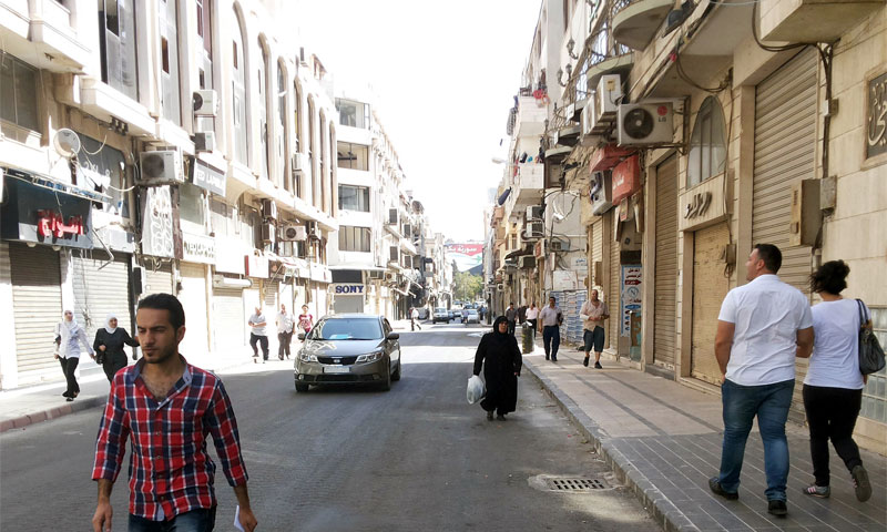 شارع الدبلان وسط مدينة حمص أيلول 2014 (سانا)