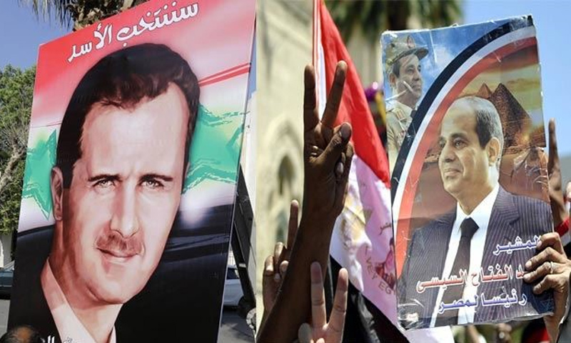 متظاهرون في شوارع القاهرة يرفعون صور السيسي والأسد (alwaght.com)