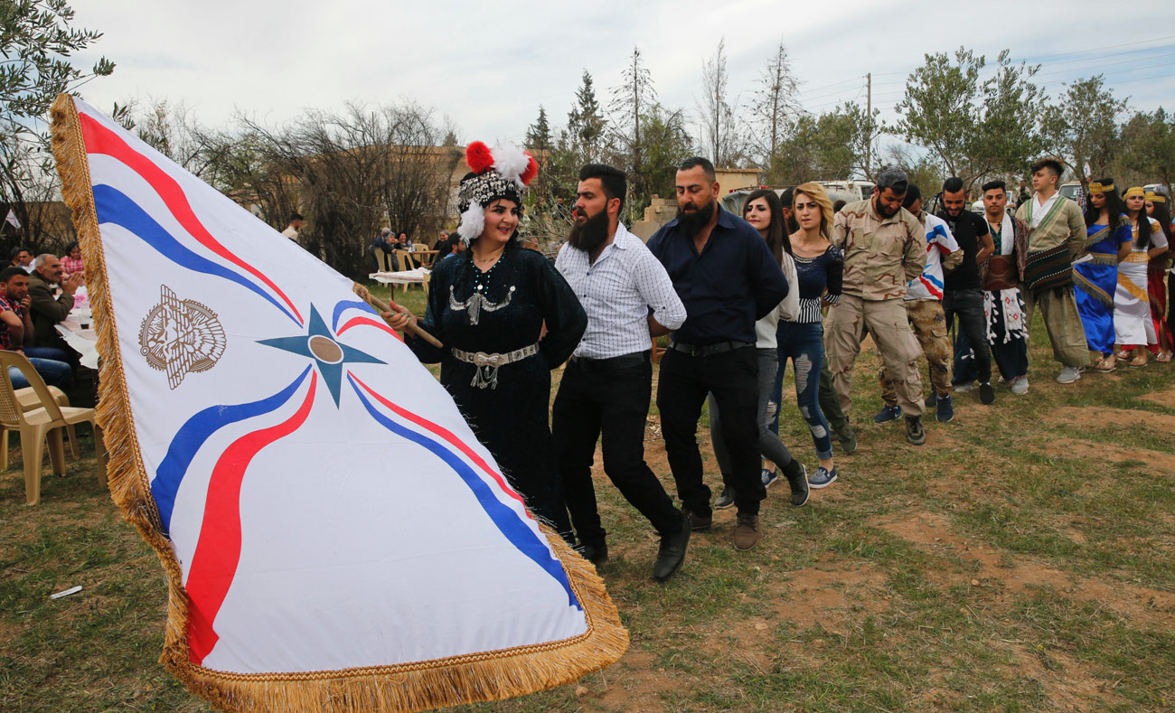 سريان يحتفلون بعيد الفصح في تل عربوش شمالي سوريا - 1 نيسان 2018 (AFP)