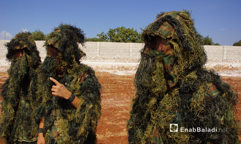عناصر من فصيل جيش النصر في أثناء معسكر تدريبي بريف حماة - تموز 2018 (عنب بلدي)