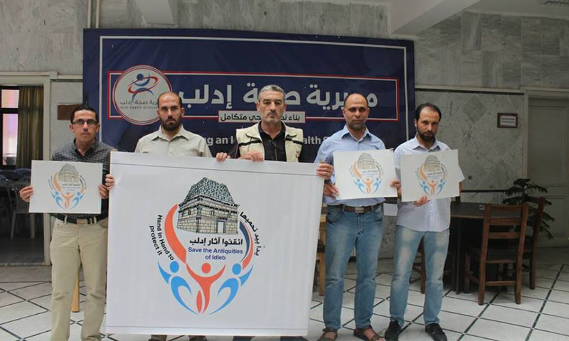 وقفة للكوادر الطبية في إدلب تضامنًا مع حملة "أنقذوا آثار إدلب"- 9 تشرين الأول 2018 (مديرية صحة إدلب)