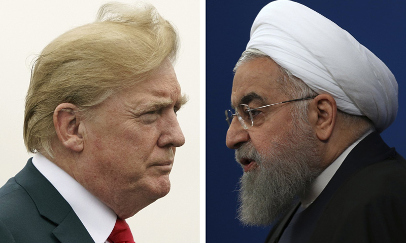 الرئيس الأمريكي دونالد ترامب ونظيره الإيراني حسن روحاني (AP)