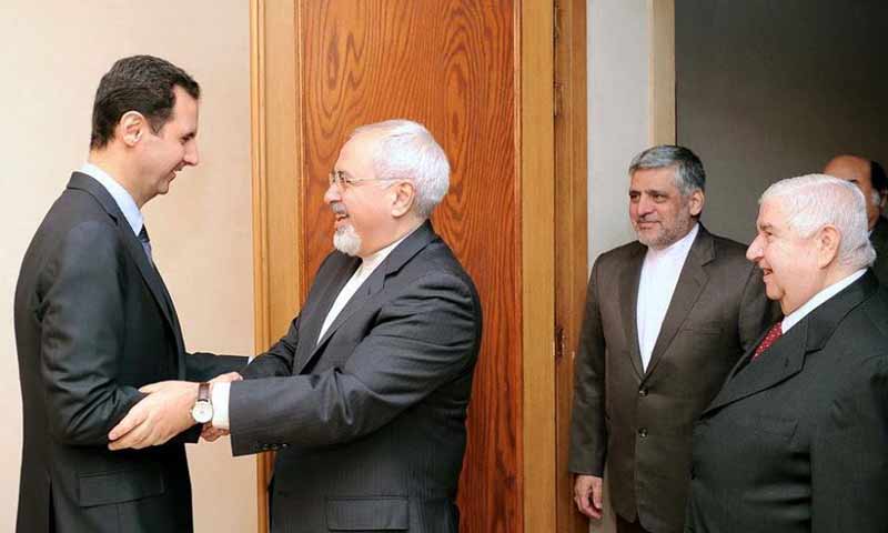 بشار الأسد ووزير الخارجية الإيراني جواد ظريف- كانون الثاني 2014 (كونا)