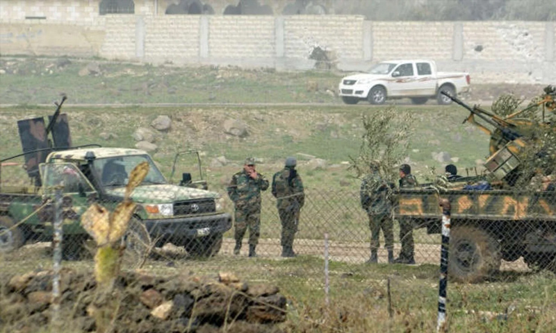 عناصر من قوات الأسد بعد السيطرة على منطقة دير العدس في درعا - 2015 (رويترز)