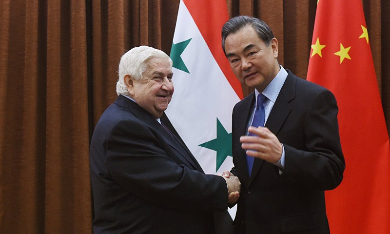 وزيري خارجية الصين وسوريا وانغ تشاو ووليد المعلم - (AFP)