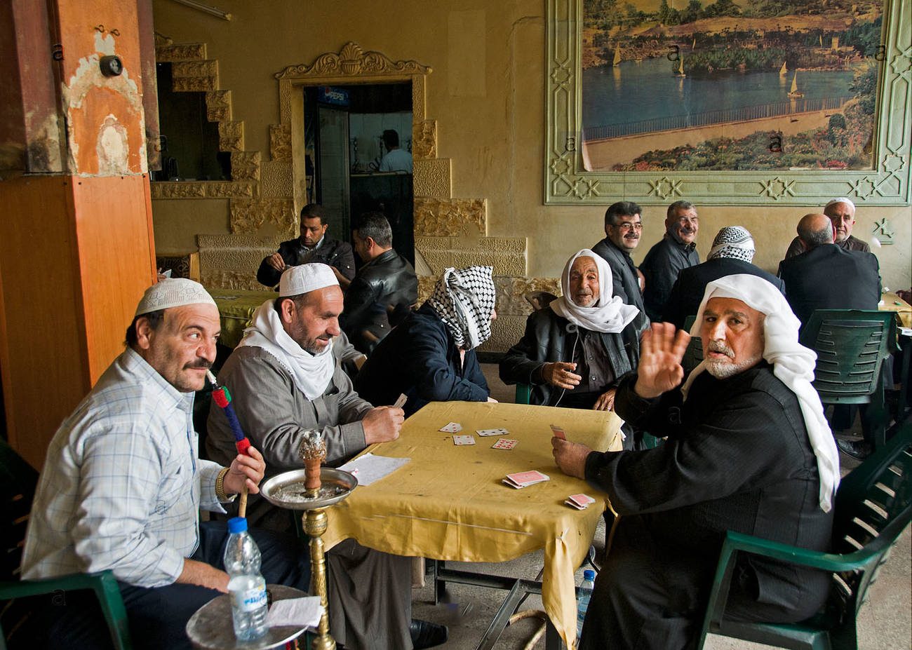 Syrian elders in Damascus café sipping tea and playing cards - 2011 Expressive (alamy)