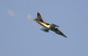 A Syrian Air Force fighter plane fires a rocket during an air strike in the village of Tel Rafat, some 37 km (23 miles) north of Aleppo, August 9, 2012. Syrian troops and rebels fought over the country's biggest city Aleppo as President Bashar al-Assad's key foreign backer Iran gathered ministers from like-minded states for talks on Thursday about how to end the conflict. (Goran Tomasevic/Reuters)