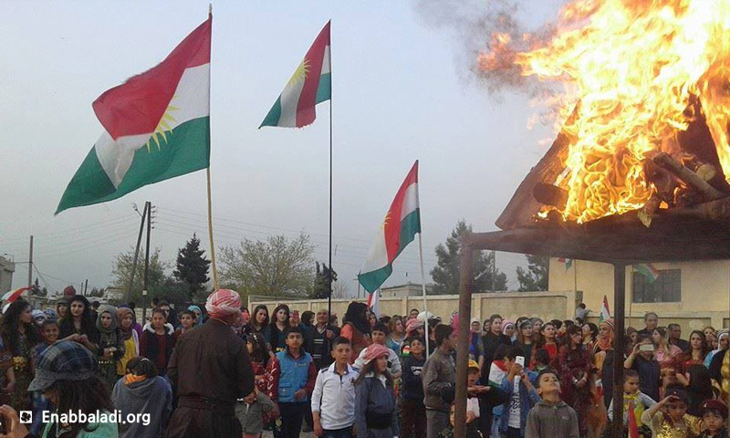 ممثلو المجلس الوطني الكردي يوقدون "شعلة نوروز" (عنب بلدي)