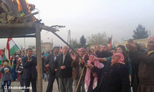 ممثلو المجلس الوطني الكردي يوقدون "شعلة نوروز" (عنب بلدي)