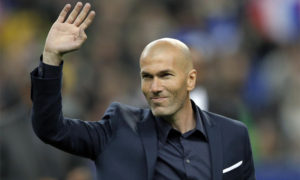 FILE - In this March 26, 2015 file photo, former soccer player and current Real Madrid B team coach Zinedine Zidane waves to spectators prior to the international friendly soccer match between France and Brazil at the Stade de France, north of Paris, France. Real Madrids President Florentino Perez announced Monday Jan. 4, 2016 that current coach Rafael Benitez has been fired and former player and Real Madrids B team coach Zinedine Zidane will take over. Benitez, hired seven months ago, has been under pressure since a demoralising 4-0 home loss to Barcelona in November. The team won seven of nine matches since the defeat at the Bernabeu, but fans continued to call for Benitez's departure. (AP Photo/Francois Mori, File) ORG XMIT: PW104