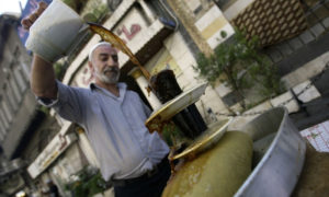 A Syrian street vendor prepares the traditional 