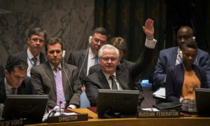 Russia's UN Ambassador Vitaly Churkin votes in the United Nations Security Council against referring the Syrian crisis to the International Criminal Court for investigation of possible war crimes at the U.N. headquarters in New York May 22, 2014. REUTERS/Lucas Jackson (UNITED STATES - Tags: POLITICS)