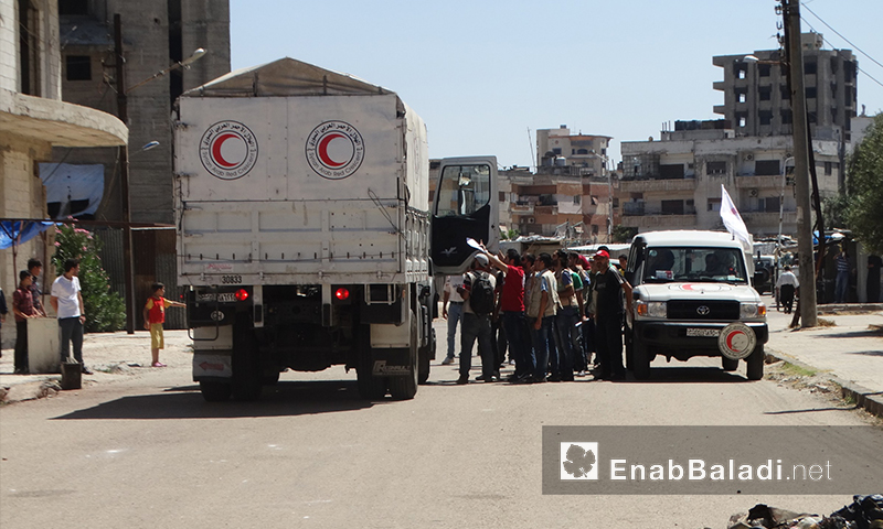 قافلة المساعدات داخل حي الوعر في حمص - الخميس 14 تموز (عنب بلدي)