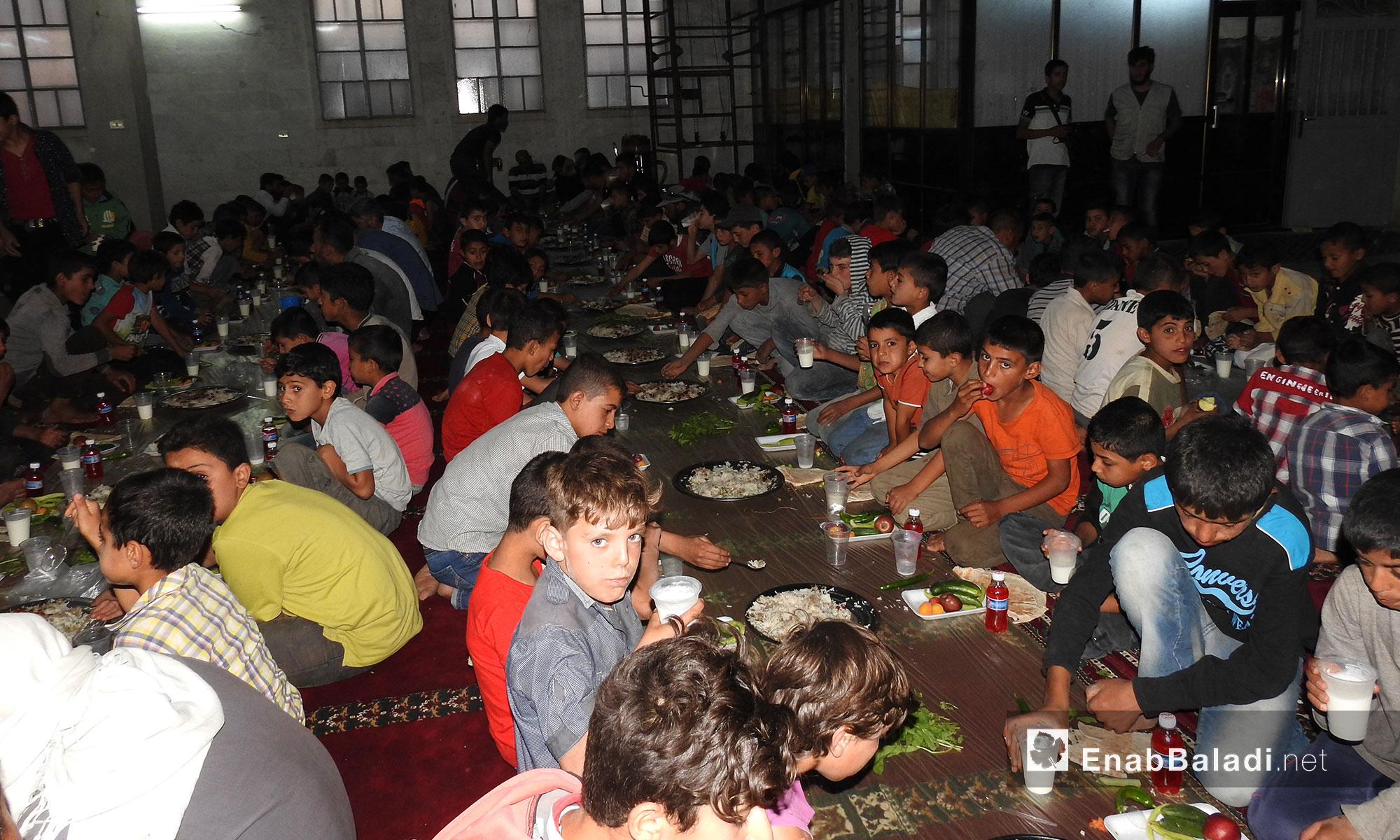 منظمة "طوبى" للإغاثة والتنمية تنظم حفل إفطار في بلدة دابق بريف حلب - 21 حزيران 2017 (عنب بلدي)