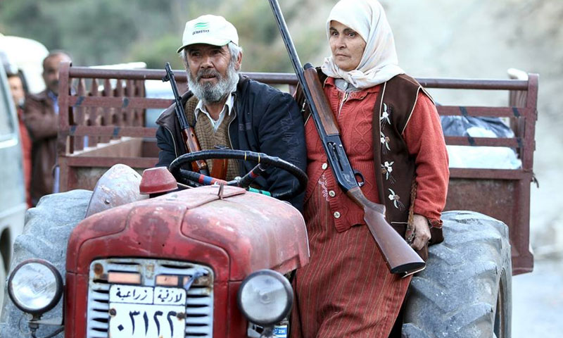 عجوزان من تركمان اللاذقية في سوريا (رويترز)
