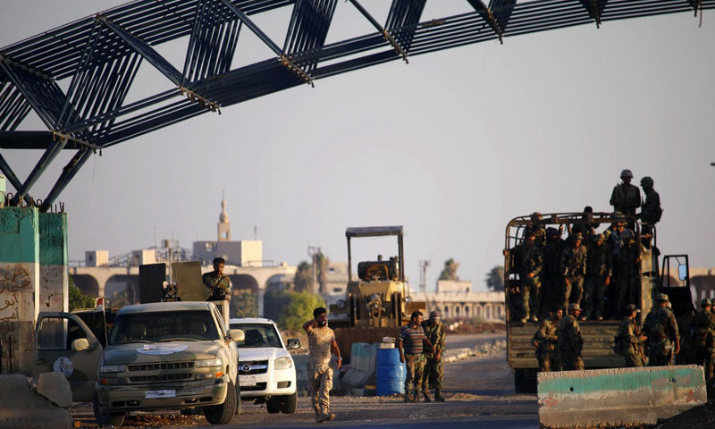 قوات الأسد في معبر نصيب الحدودي (AFP)
