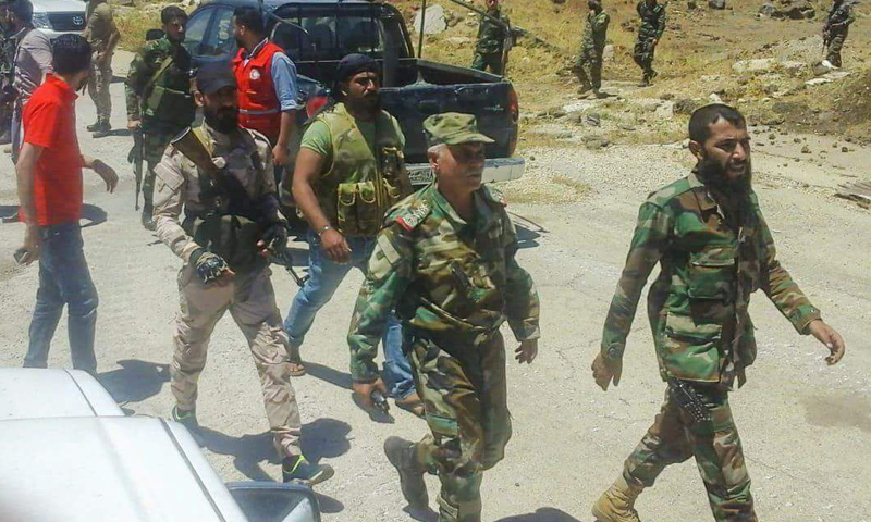 عناصر من قوات الأسد خلال تنفيذ اتفاق محافظة القنيطرة - 20 من تموز 2018 (دمشق الآن)
