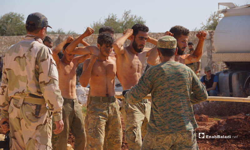 عناصر من فصيل جيش النصر في معسكر تدريبي بريف حماة الشمالي - تموز 2018 (عنب بلدي)
