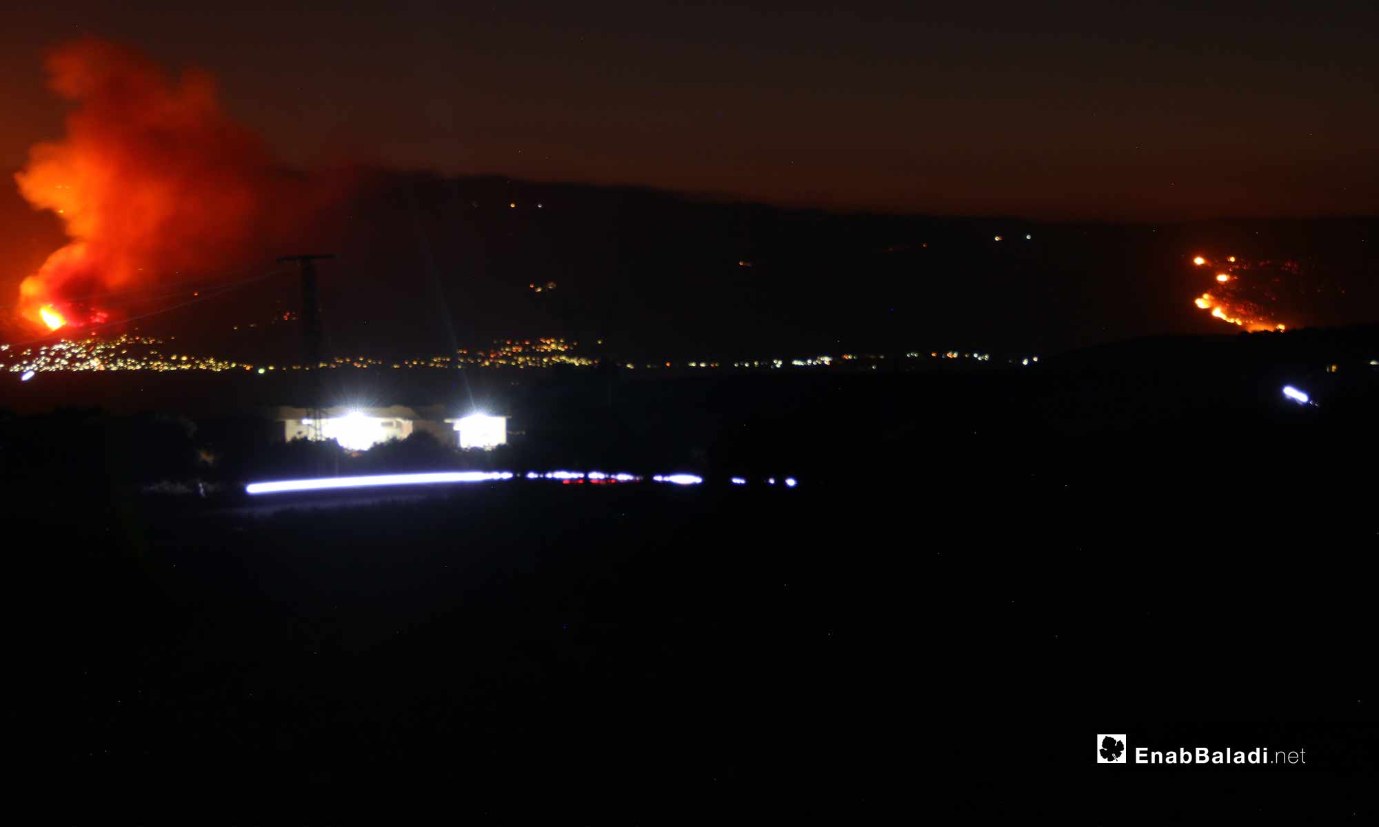 حريق في معسكر جورين بسهل الغاب غربي حماة إثر قصف لفصائل المعارضة - 5 أيلول 2018 (عنب بلدي)