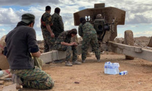 مقاتلون من وحدات حماية الشعب الكردية في أثناء العمليات العسكرية في جيب هجين - كانون الأول 2018 (الصحفي 
‏‎Mohammed Hassan‎‏ / فيس بوك)