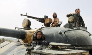 عناصر من قوات الأسد قرب قرية عرجون في ريف القصير - 2013 (رويترز)
