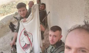 عناصر الدفاع الوطني التابع لقوات الأسد أثناء مشاركتهم في معارك ريف حماة الغربي ضد فصائل المعارضة 6 حزيران 2019 (الدفاع الوطني)