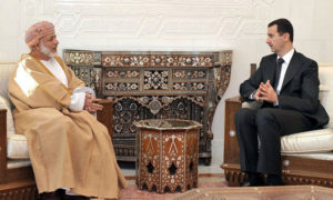 رئيس النظام السوري بشار الأسد وزير الخارجية العماني يوسف بن علوي (AFP)