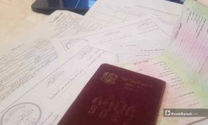 أوراق ثبوتية ودفتر عائلة سوري في أمانة السجل المدني بمعرة النعمان,- (عنب بلدي)