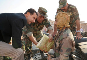 عناصر من قوات الأسد خلال الحملة العسكرية في القنيطيةر - تموز 2018 (رويترز)
