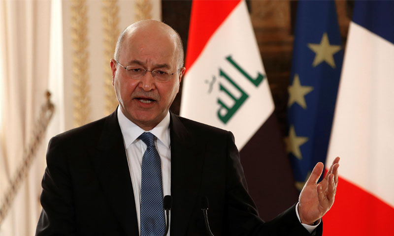 الرئيس العراقي، برهم صالح، خلال مؤتمر صحفي في باريس -25 شباط 2019 (رويترز)