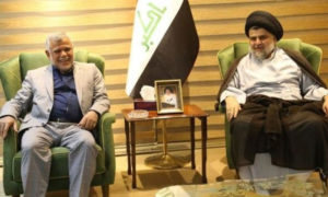 مقتدى الصدر وهادي العامري خلال اجتماق سابق (قناة العالم الإيرانية)
