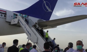 السورية للطيران تقل السوريين العالقين في من مطار بغداد الدولي في العراق (سانا)