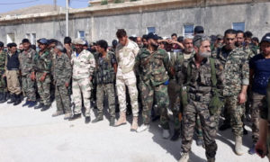 عناصر من الدفاع الوطني الرديفة لقوات النظام أثناء توجههم إلى منطقة البادية لملاحقة خلايا تنظيم الدولة - 19 أيار 2020 (الدفاع الوطني)