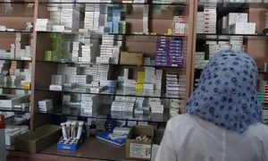 A pharmacist looks for medication at a pharmacy in Damascus on September 17, 2013. Drug production in Syria has come to a near total halt in the country ever since the brutal war broke out 30 months ago, which has caused drug shortages of locally-produced medicines and foreign produced medicines are now being smuggled in at five times the price, a government newspaper warned. AFP PHOTO / ANWAR AMRO        (Photo credit should read ANWAR AMRO/AFP/Getty Images)