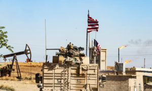 مدرعة أمريكية قرب أحد حقول النفط في الرميلان شمال شرقي سوريا (CNN)