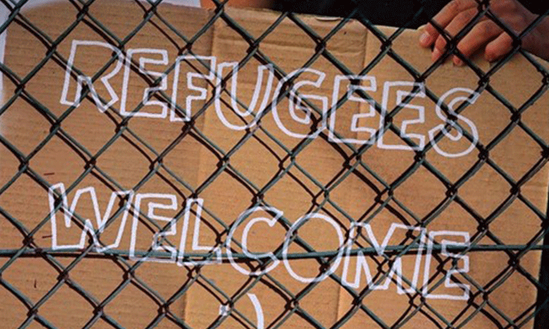 لوحة تعبر عن الترحيب باللاجئين- تعبيرية (scambs.gov)