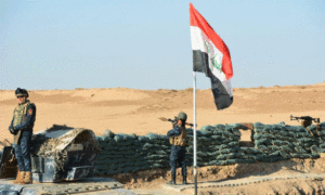 عناصر من الجيش العراقي على الحدود السورية العراقية (AFP)