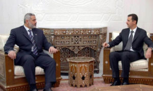 رئيس النظام السوري بشار الأسد ورئيس المكتب السياسي لحركة 
