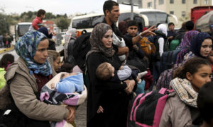 لاجئون سوريون في بريطانيا (رويترز)