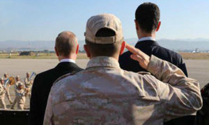 فلاديمير بوتين وبشار الأسد في قاعدة حميميم العسكرية في سوريا (سبوتنيك)