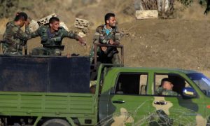 عناصر من جيش النظام خلال سيطرتهم على القنيطرة - 26من تموز 2018 (AP)
