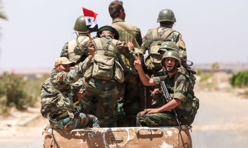 عساكر تابعين لقوات النظام السوري (Getty Images)