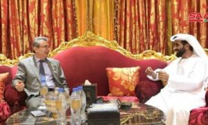 السفير السوري لدى الإمارات، غسان عباس، مع عضو المجلس الاستشاري الوطني لإمارة أبوظبي، الشيخ مسلم بن سالم بن حم العامري، (سانا)، 2021.