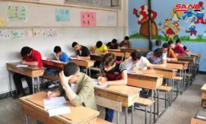 طلاب يؤدون امتحاناتهم في إحدى المدارس في دمشق 2021 (سانا) 