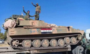 مقاتلون من ميليشيا الدفاع الوطني الرديفة بقوات النظام السوري (الدفاع الوطني/ فيس بوك)