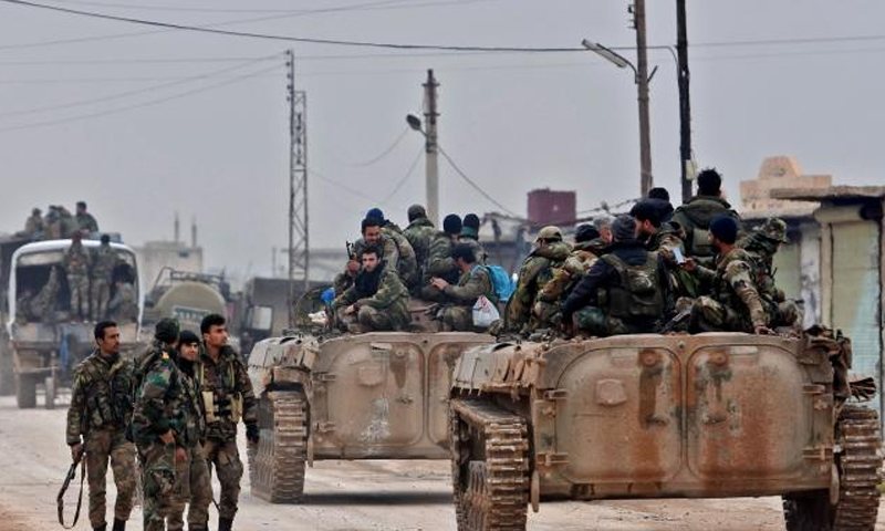 وحدات من قوات النظام السوري قرب قريقة طوقان شمالي سوريا (AFP)