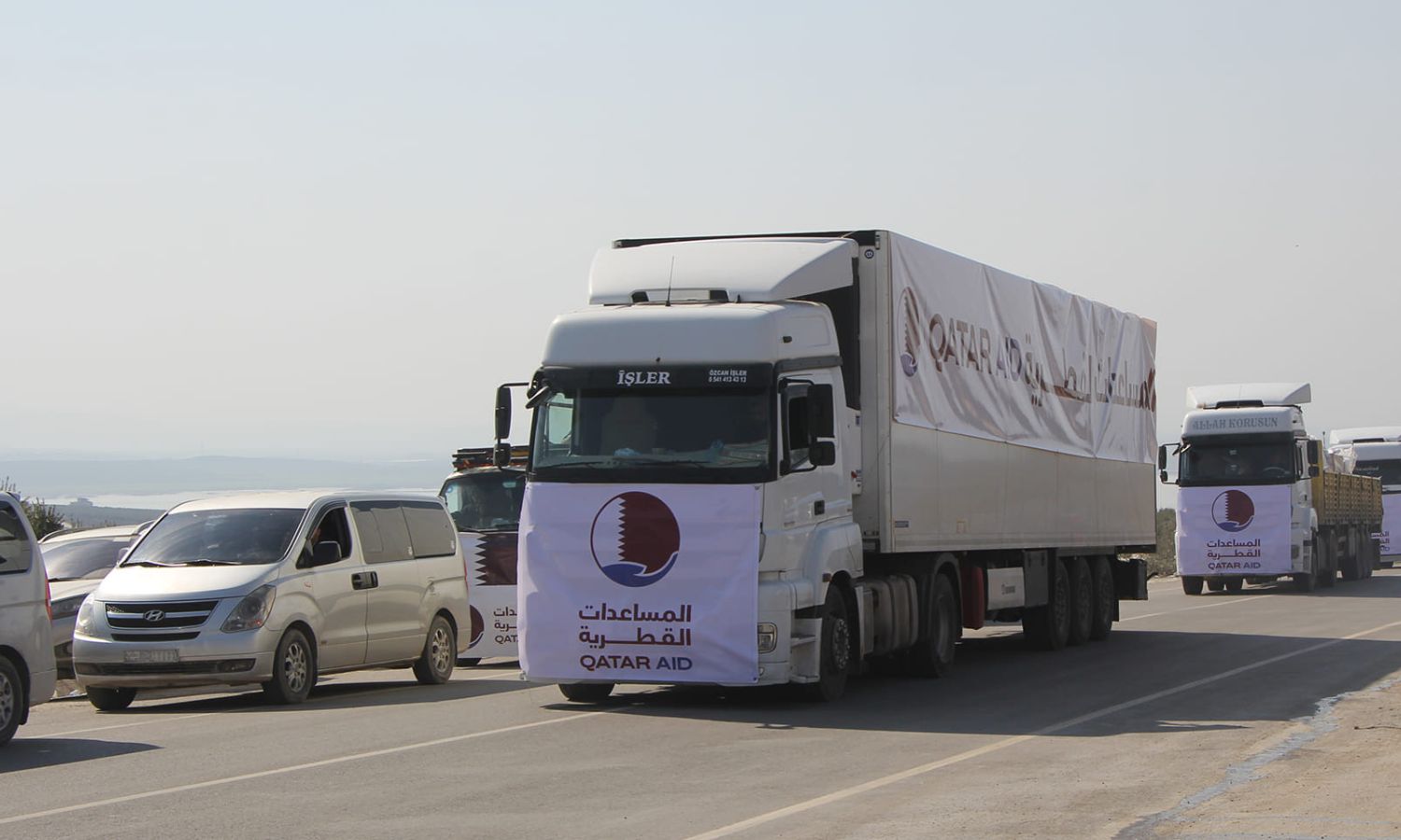 مساعدات إغاثية من دولة قطر إلى الشمال السوري تدخل عبر معبر "الحمام" بريف حلب – 16 شباط 2023 (مكتب جنديرس الإعلامي)
