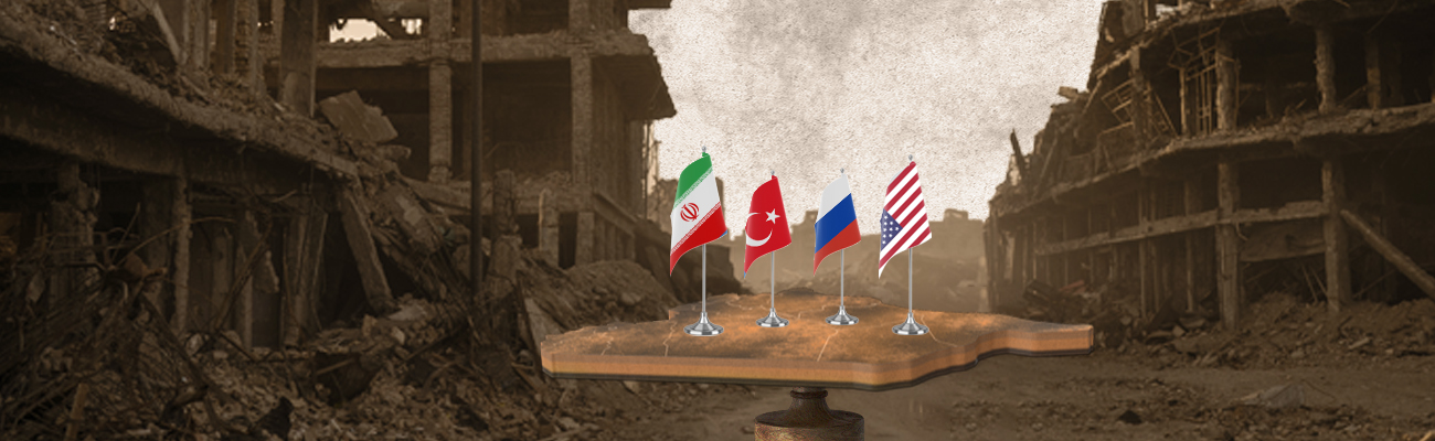 طاولة عليها علم تركيا وإيران وروسيا وأمريكا في شارع مدمر بسوريا (تعديل عنب بلدي)