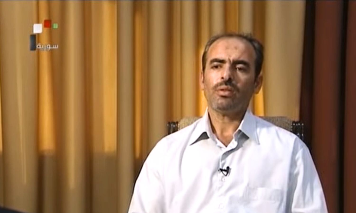 المقدم حسين هرموش خلال ظهوره على وسائل إعلام النظام السوري-15 من أيلول 2011 (syrianRTV)